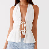 White halter top with lace-up front worn by a model